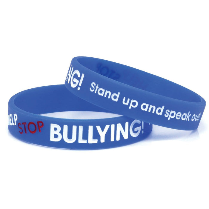 Two blue silicone wristbands with the text "STOP BULLYING!" and "Stand up and speak out" printed in white and red, designed to promote awareness and encourage an anti-bullying message. Product Name: 100 Pack - Anti-Bullying ½” Blue Silicone Wristband