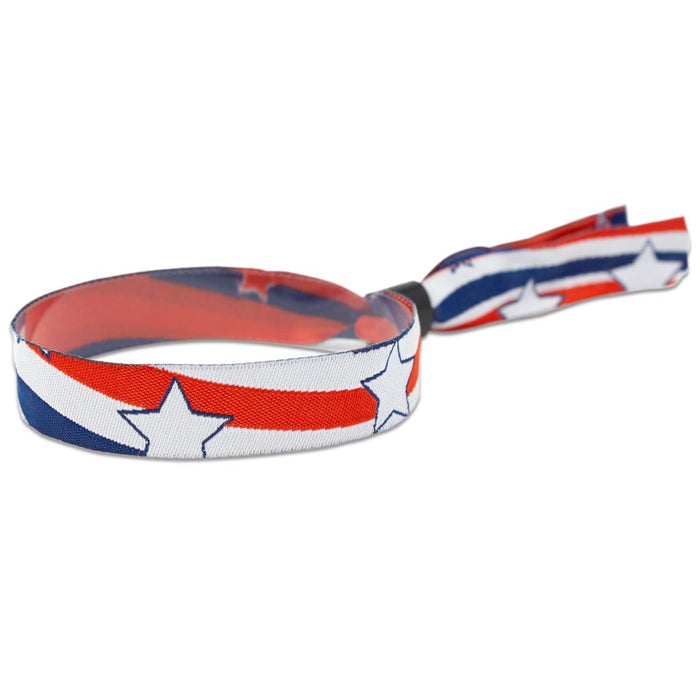 Fabric bracelet with a red, white, and blue star pattern, secured by a knot. These 100 Pack - Liberty Design 1/2" High Security Adjustable Closure Woven Wristbands add a stylish touch to guest management while ensuring comfort and security.