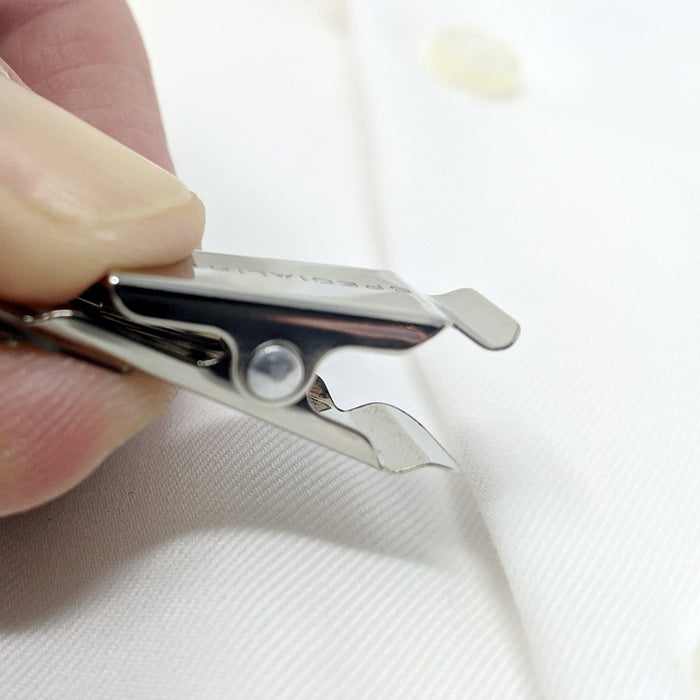 Close-up of a 5 Pack - Purple Heavy Duty Plastic Volunteer Badges with Clothing Friendly Clip being used on a white fabric surface, showing the precision of this clothing-friendly clip.