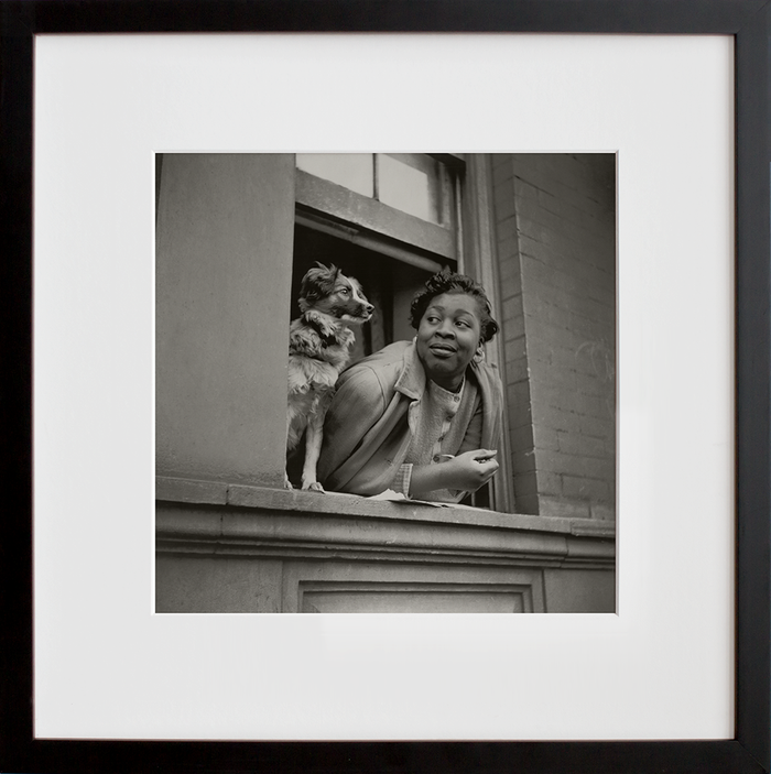 A woman and her dog in the Harlem section