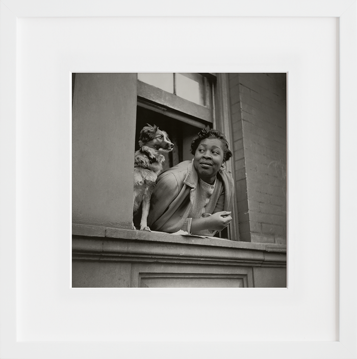 A woman and her dog in the Harlem section