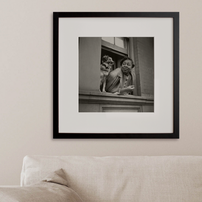 A woman and her dog in the Harlem section