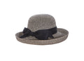 Backbow Roller Sunhat. Packable Straw Braid Roller Sunhat featuring a classic kettle-style upturned brim,  and an adjustable drawstring inner band for a customized fit. The black woven straw hat is accented with black grosgrain banding around the base of the crown and a prominent black fabric bow at the back, shown against a solid white background.