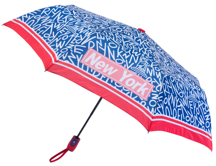 Navy and covered edge to edge with bold white “NEW YORK” lettering, this umbrella hides iconic city landmarks within the letter shapes, revealed on closer look. Four standout “NEW YORK” words in block lettering appear on alternating triangular panels, each set inside a red‑and‑white box with a fine white border, echoed by a matching red‑and‑white rim. The finial and handle are red, and it opens easily with a single push of a button.