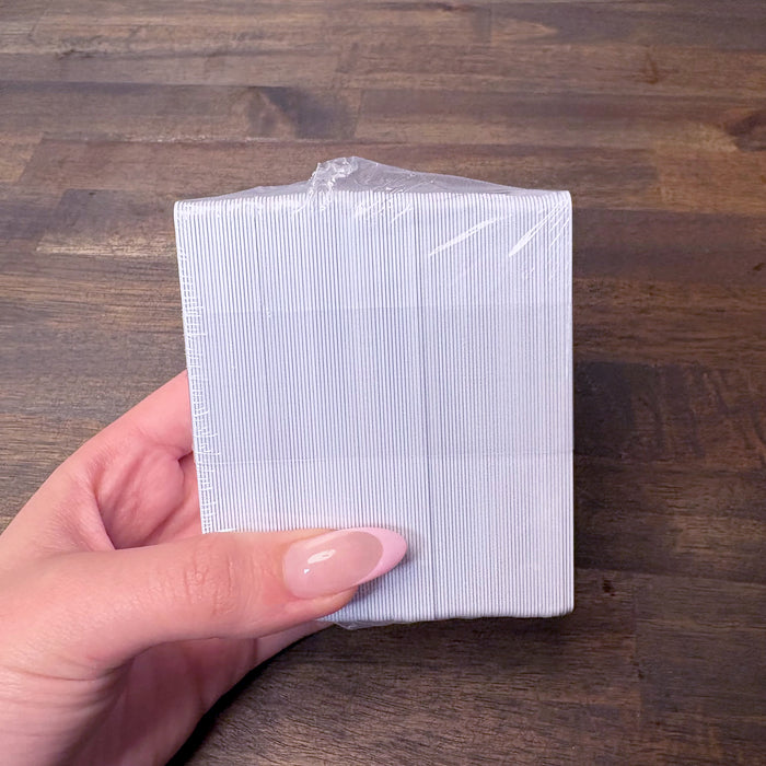 Shrink-wrapped 100 pack of blank white composite PVC/PET cards