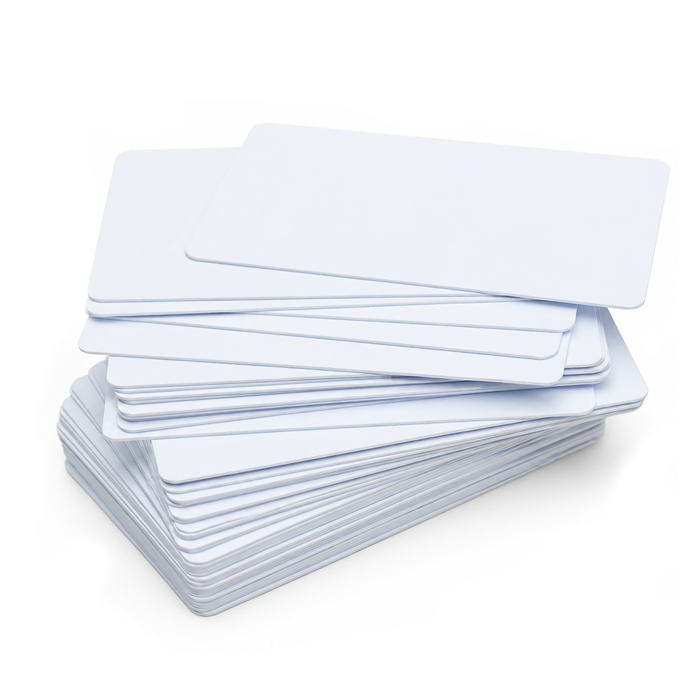 Stack of blank white CR80 composite PVC/PET cards on white background