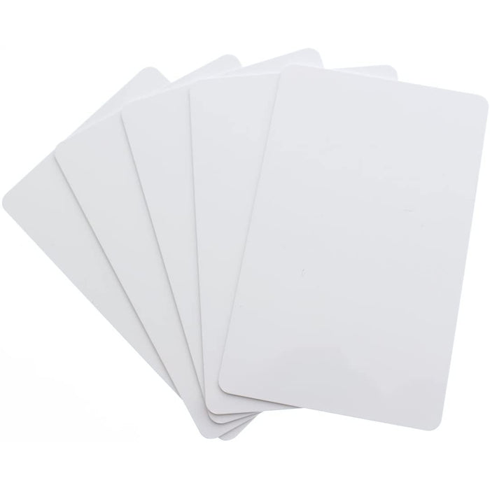 Six blank white CR80 PVC cards overlapping on white background