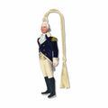 Metal bookmark ornament of George Washington standing against a white background, wearing a navy coat with gold buttons, a yellow vest, and light‑yellow breeches. A white cravat is tied at his neck, and a small yellow fabric loop at the top serves as a placeholder in a book. The thin, etched metal gives the bookmark a distinct tactile feel, making it easy to locate by touch between pages.