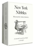 Packaging of 'New York Nibbles' notecards with illustration of a pigeon eating lo mien, and text.