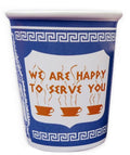 A ten ounce ceramic mug decorated in blue and white with the traditional Greek Deli cup design, A large panel in the center says "We are happy to serve you" in a Greek-looking font above three steaming coffee cups.
