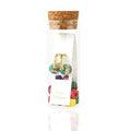 A small clear glass vial with a cork stopper sits against a white background. Inside are petite gold hoops and eight pairs of natural, semi-precious gemstone beads in a variety of colors, including soft aqua amazonite, deep blue lapis, sunny yellow aventurine, rich red jasper, vibrant green malachite, and purple jasper. The beads can be mixed and matched on the hoops to create different looks.