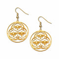 Gold bee and honeycomb patterned earrings on a white background