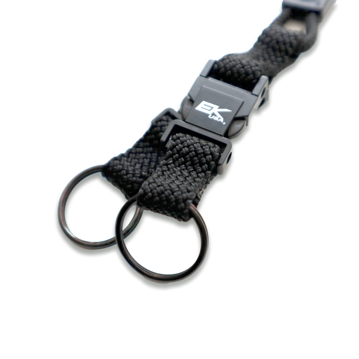 Close-up of an EK Black Lanyard by EK USA with two detachable key rings and a clasp, perfect for those seeking stylish key chain holders. Sold by Specialist ID.