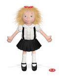 The image shows a soft 18‑inch Eloise doll wearing a ruffled white blouse, black pleated skirt, and shiny satin shoes. She has short blond hair topped with a red bow and a smooth, silk‑printed face with a bright, mischievous expression, designed as a high‑quality collectible toy.