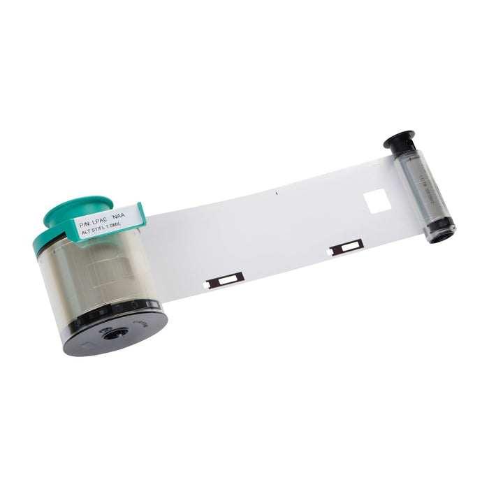 An Evolis LPA073NAA HighTrust Alternate Clear Patch 1.0 mil ribbon for Avansia and Agilia CLM, 600 prints, with a green cap and a partially unspooled transparent film strip showing rectangular black marks.
