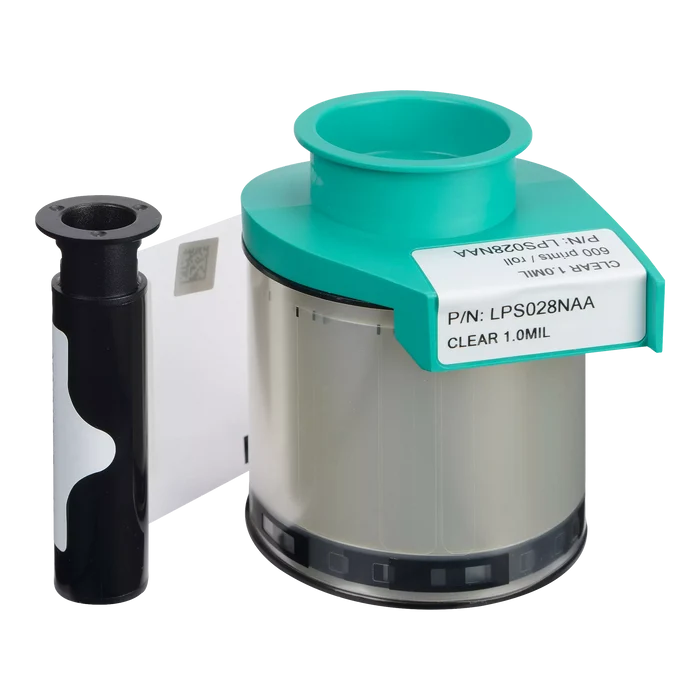 A clear 1.0mL medical syringe cartridge with a teal cap sits beside a black and white cylinder, resembling the Evolis LPS028NAA Clear Patch Lamination Ribbon (600 prints), made for Primacy and Primacy 2 Laminators.