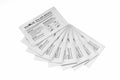 A fan-shaped arrangement of nine adhesive alcohol cleaning cards from Evolis A5002 Pre-Saturated Cleaning Cards - Pack of 50 Cleaning Cards, perfect for maintaining your Evolis card printers, shown on a white background with detailed usage instructions.