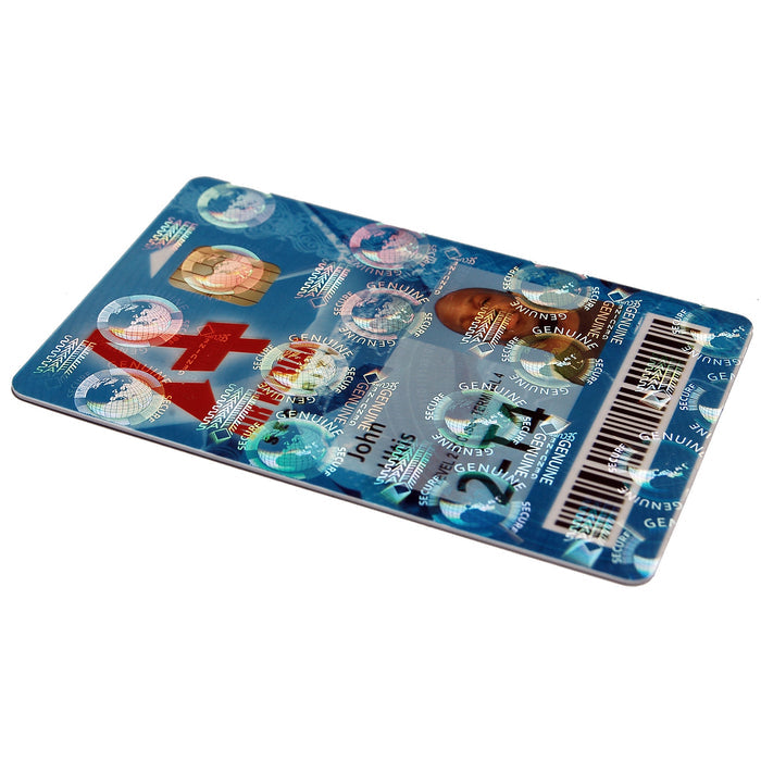 The Evolis R4002 Optoseal Holographic Ribbon – 350 Prints creates a blue ID card with barcodes, photo, text, security holograms, and a holographic varnish overlay, displayed at an angle on a white surface.