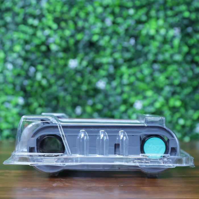 Side view of the Evolis RCT216NAAA metallic gold monochrome ribbon in sealed clamshell packaging, showing black and teal spools through the clear plastic. Photographed and sold by Specialist ID, an authorized Evolis dealer.