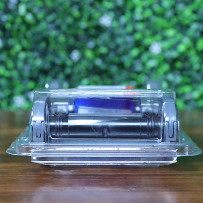 Front view of the Evolis RCT217NAAA metallic silver monochrome ribbon inside sealed clamshell packaging, showing the twin spool design and inner print cartridge. Photographed and sold by Specialist ID, an authorized Evolis dealer.