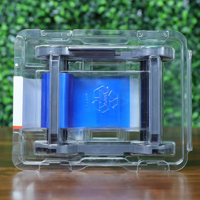 Top view of the Evolis RCT217NAAA metallic silver monochrome ribbon inside clear blister packaging, showing the blue ribbon layer and recyclable symbol. Photographed and sold by Specialist ID, an authorized Evolis dealer.