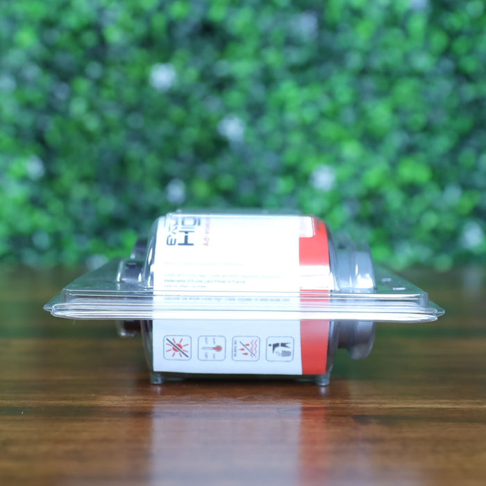 Side view of the Evolis RTCL009NAA clear transfer ribbon showing the warning icon label through the plastic blister pack. Photographed and sold by Specialist ID, an authorized Evolis dealer.