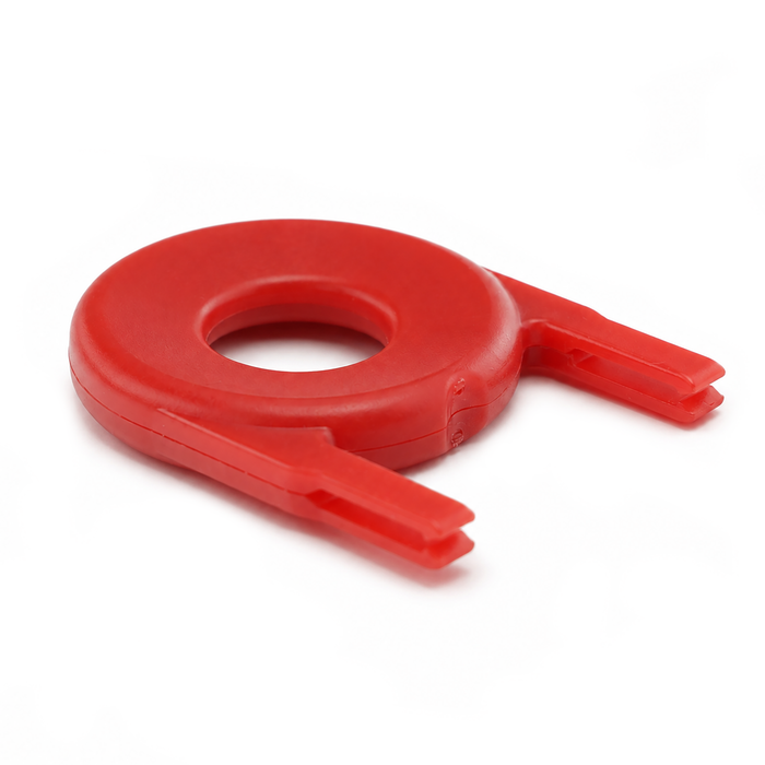 A red-orange, U-shaped plastic object with a circular hole in the center, perfect for securing with Guard Key For Locking Card Holder (P/N 1840-6615).