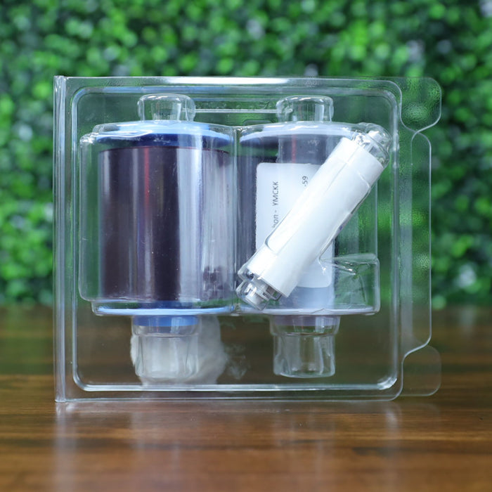 "Back view of Fargo 84912 YMCKK ribbon in clear blister packaging, showing color ribbon rolls and cleaning spool. Photographed and sold by Specialist ID, an authorized Fargo dealer.