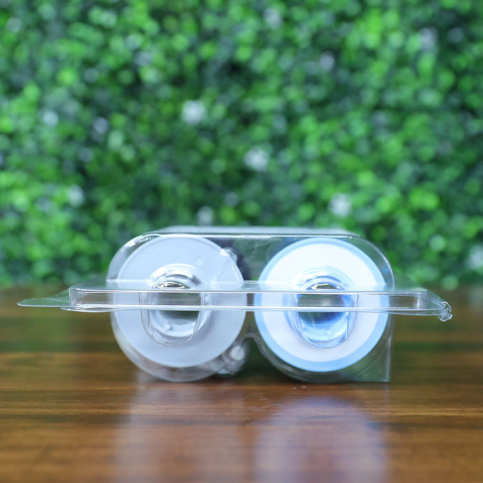 Bottom view of HID Fargo 84912 YMCKK ribbon inside sealed blister packaging, showing white and blue spool ends. Photographed and sold by Specialist ID, an authorized Fargo dealer.