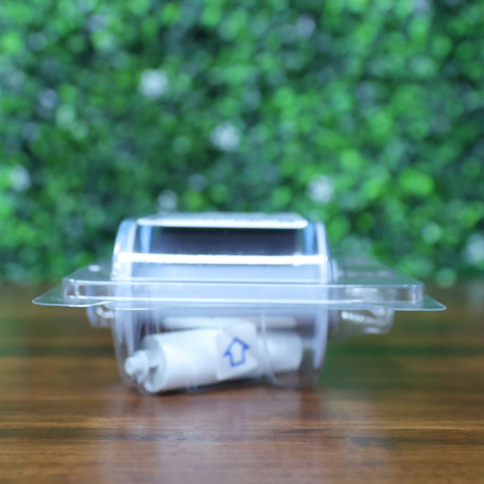 Top view of HID Fargo 84912 YMCKK ribbon sealed in blister packaging, showing black ribbon roll and included cleaning roller. Photographed and sold by Specialist ID, an authorized Fargo dealer.
