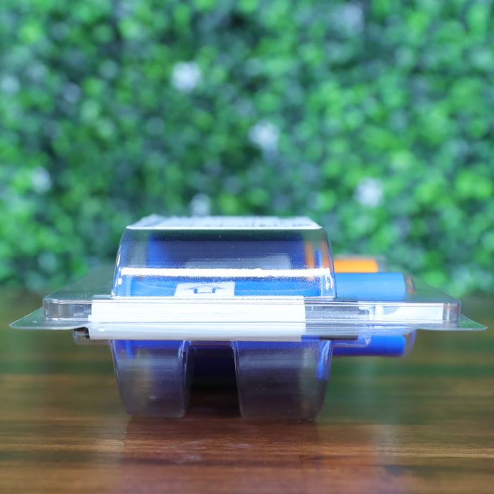 Side profile of Fargo 45611 YMCKOK ribbon cartridge in sealed plastic clamshell packaging, showing blue and orange spool edges through clear casing. Photographed and sold by Specialist ID, an authorized Fargo dealer.