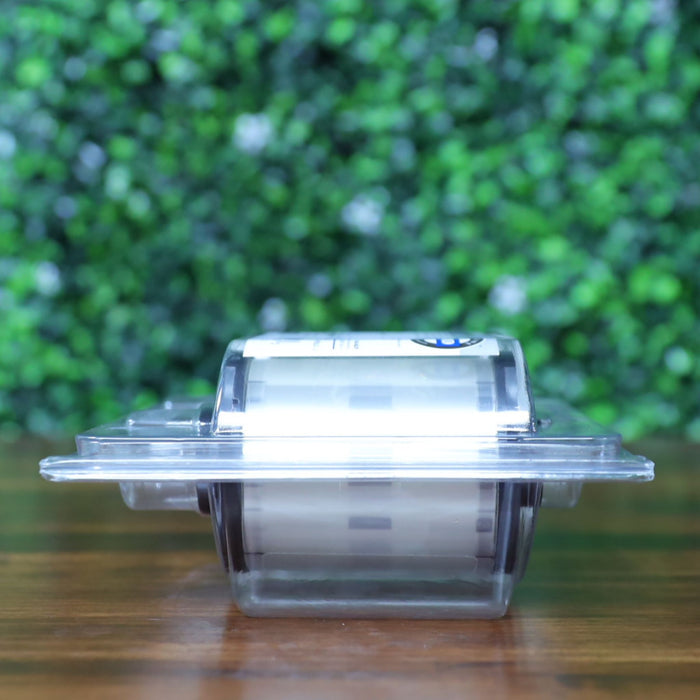 Right side view of the HID Fargo 82603 PolyGuard overlaminate ribbon in sealed blister pack, clearly showing the transparent film with faint security markings. Photographed and sold by Specialist ID, an authorized Fargo dealer.