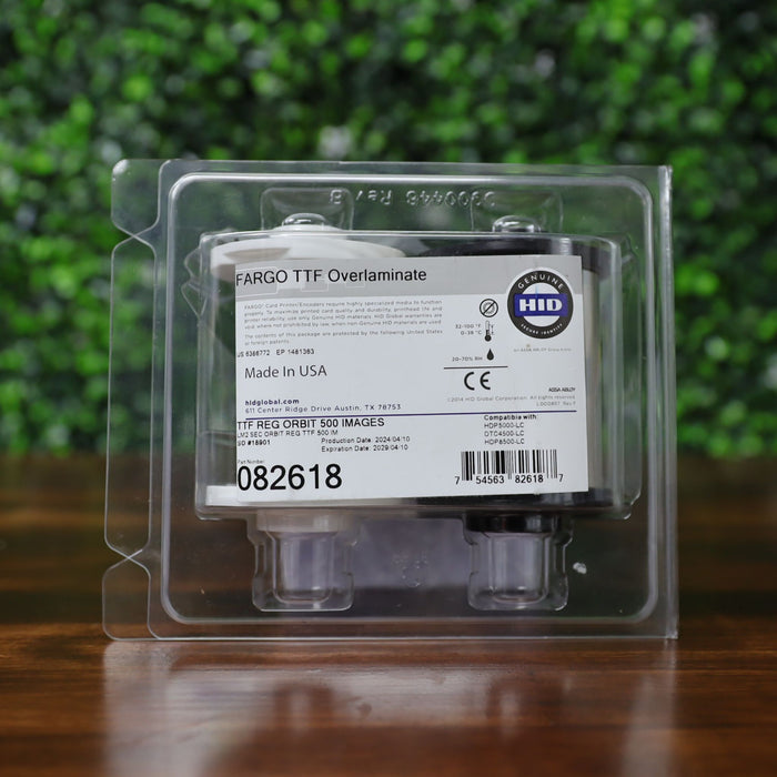 HID Fargo 82618 holographic overlaminate in retail clamshell packaging with visible model number, barcode, compatibility list, and Genuine HID seal. Photographed and sold by Specialist ID, an authorized HID Fargo dealer.