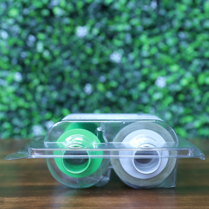 Bottom view of Fargo 84500 retransfer film in sealed packaging showing green and white spool ends inside clear clamshell case. Photographed and sold by Specialist ID, an authorized HID Fargo dealer.