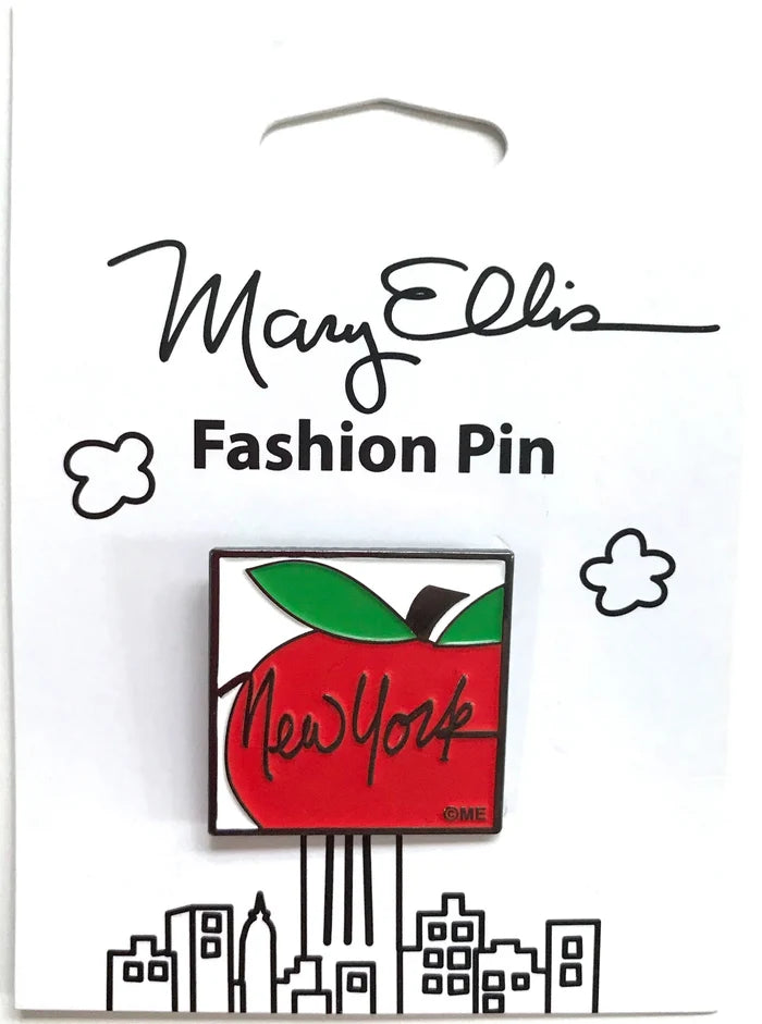 Red Apple Pin:
A graphic symbol illustration with smooth, rounded edges, reminiscent of an emblem or logo. The bright red apple is shown in a partial view as a solid shape with minimal detail, topped with a bright green leaf and a black stem. The words “New York” appear in black cursive lettering across the apple, adding a playful, handwritten feel. The pin is displayed on crisp white illustrated packaging, which enhances contrast and allows the bold colors and simple design to stand out clearly.