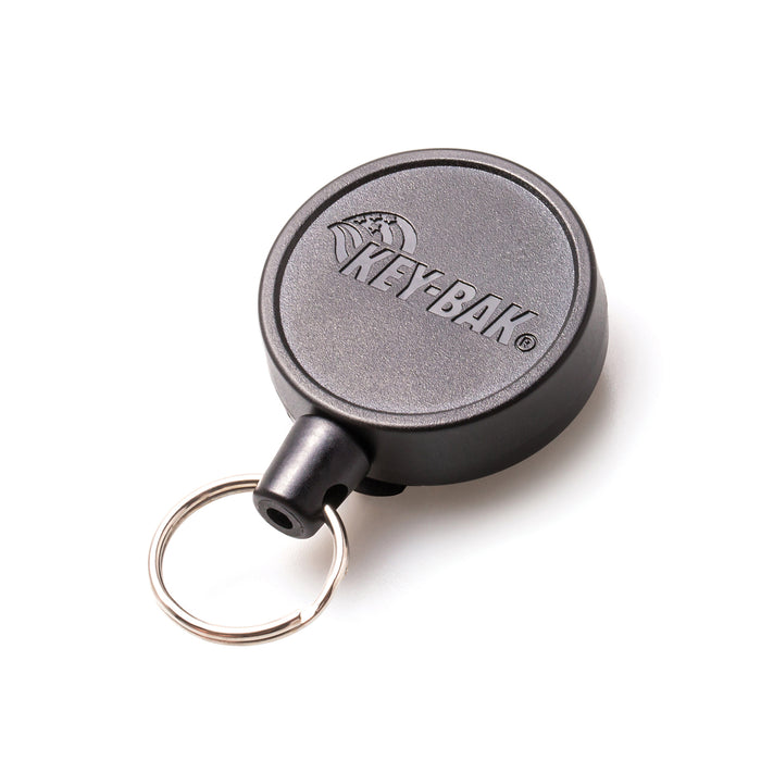 A black retractable Key-Bak Mid Size Key Ring Badge Reel with Belt Clip (#6) with a silver key ring attached, complete with the "KEY-BAK" logo and a convenient belt clip. Sold by Specialist ID.