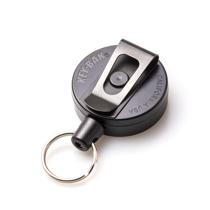 A black Key-Bak Mid Size Key Ring Badge Reel with Belt Clip (#6) with a metal belt clip and a circular key ring attachment. Sold by Specialist ID.