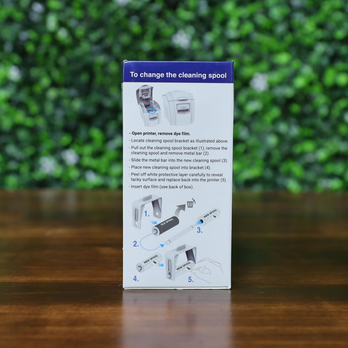Side of Magicard MA1000K-RED ribbon box showing step-by-step cleaning spool replacement instructions with illustrations. Photographed and sold by Specialist ID, an authorized Magicard dealer.