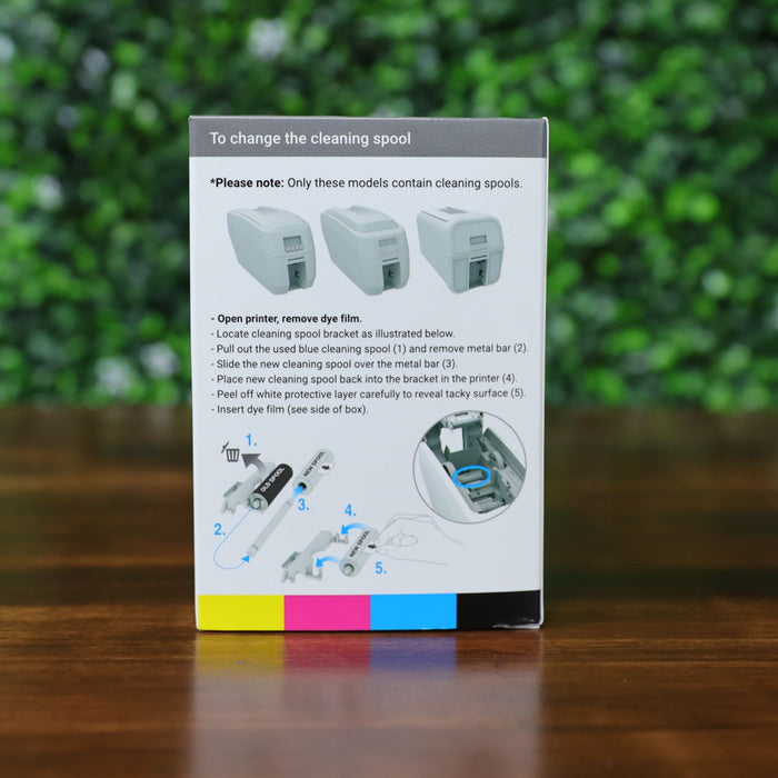 Back of Magicard MB200YMCKO/2 ribbon box showing step-by-step cleaning spool replacement instructions with visual diagram and printer compatibility notice. Photographed and sold by Specialist ID, an authorized Magicard dealer.