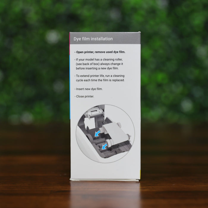 Box displaying installation instructions for the Magicard MB600KO Black Ribbon with Overlay – 600 Prints for Magicard 600 Printer, including a diagram showing how to insert the dye film for producing monochrome ID cards.