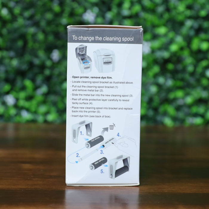 Side of the Magicard PR300COL YMCKO ribbon box showing detailed cleaning spool replacement instructions with numbered illustrations and printer diagrams. Photographed and sold by Specialist ID, an authorized Magicard dealer.