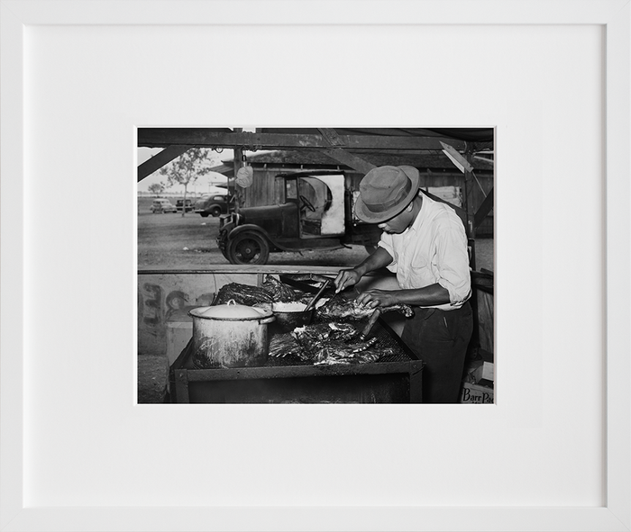 Man slicing barbecue at the Gonzales County Fair