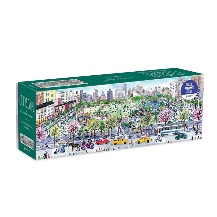 A colorful panoramic illustration of Central Park on a summer day in New York City. People walk along winding park paths while cyclists ride by, and families relax on the grass. The iconic Central Park Carousel is bustling with riders, while the Lake glistens in the sunshine with small boats plying the water. The Great Lawn is filled with picnickers and outdoor activities. Along Central Park South, yellow taxis, pedicabs, and a horse-drawn carriage travel, set against a skyline of tall Manhattan buildings.