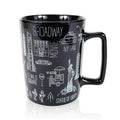 Black mug with white New York-themed illustrations on a white background