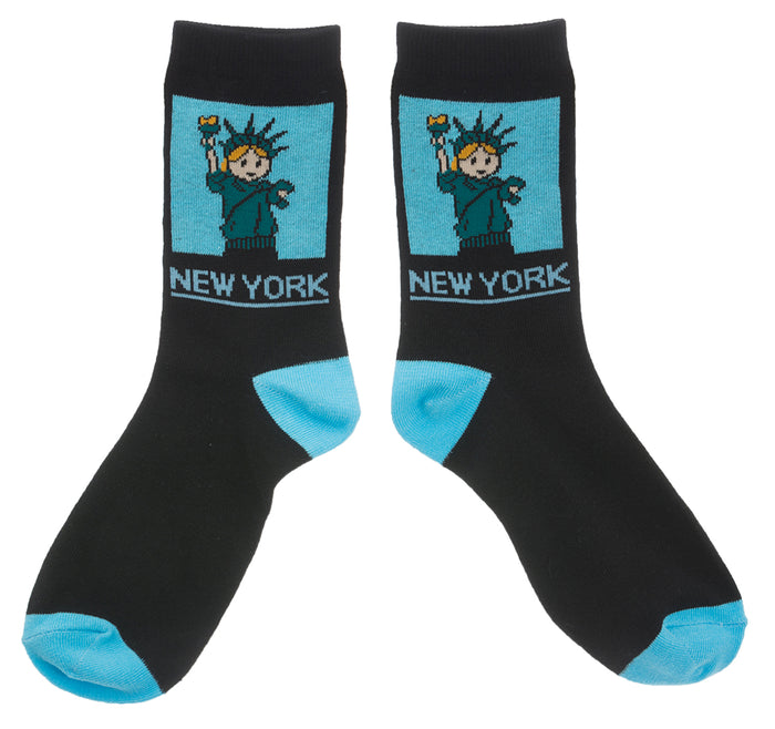 NYC Cartoon Statue of Liberty Socks 
These black crew socks feature a soft, woven cartoon image of the Statue of Liberty. On the ankle is a square blue panel outlined, containing a friendly aqua-green Lady Liberty with small orange details in her hair and torch flame. Below the panel, “NEW YORK” appears in large, bold lettering in blue. The socks feel smooth and flexible, made for comfortable everyday wear with playful New York character.