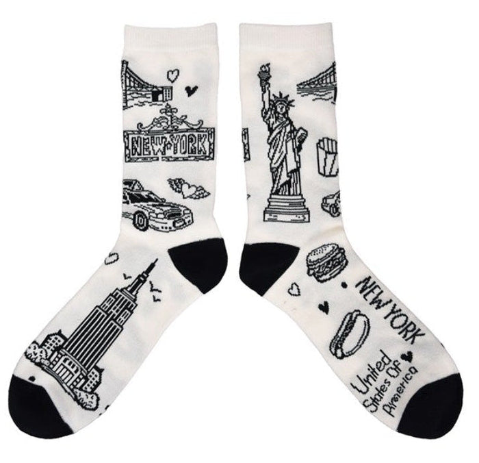 Pair of socks with black ink illustrations of NYC  icons on a white background.