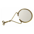 A small magnifying glass with a round 2‑inch lens, held upright in an antiqued brass brace that flows into a slim 4½‑inch handle. The handle twists gracefully and ends in a bow-shaped detail. Shown on a white background, the vintage-style magnifier enlarges text up to three times.