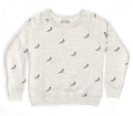 This unisex crew neck sweatshirt is made from soft, breathable fabric and feels smooth and comfortable on the skin. It has a relaxed fit with a round neckline, long sleeves, and gently ribbed cuffs and hem. The surface is covered in a repeating illustration of pigeons in shades of grey, with small pink feet adding contrast, giving the garment a playful, city‑inspired character.