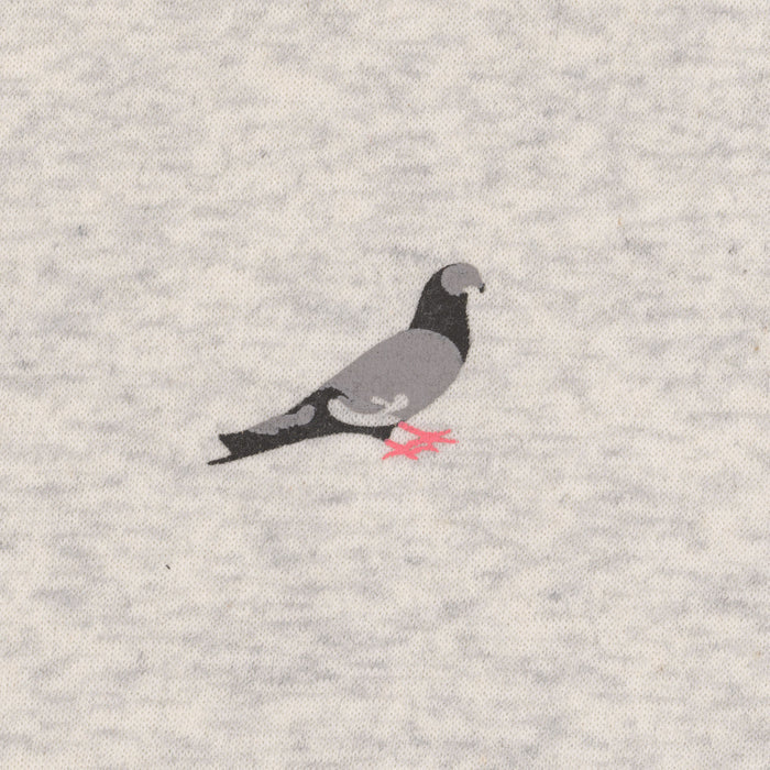 The image shows a pigeon motif in soft shades of gray with pink feet, printed on a heather‑gray sweatshirt fabric.