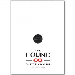 The image shows the back of the enamel pin’s packaging. Printed text reads: “THE FOUND … GIFTS & MORE … THEFOUND.COM.”